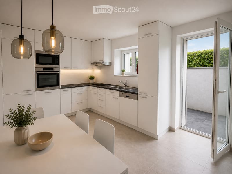 Modern kitchen with white cabinets, stainless steel appliances, a central island with a dining table and chairs, pendant lights, and a sliding glass door leading to a balcony.