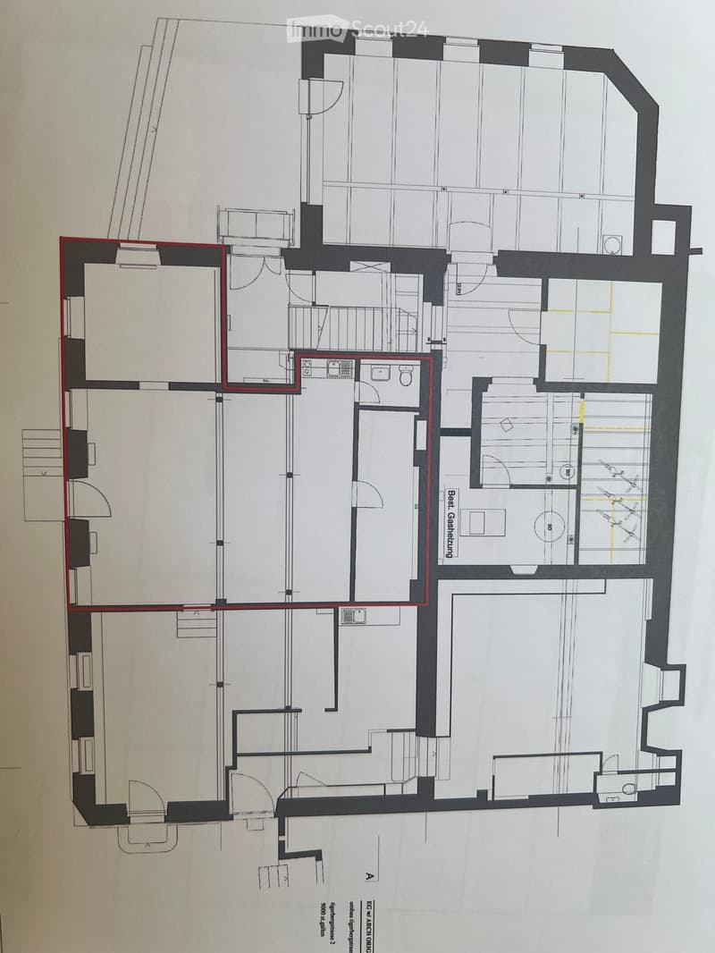 Floor plan of a residential building with multiple rooms including a living room, kitchen, bedrooms, bathrooms, and a garage.