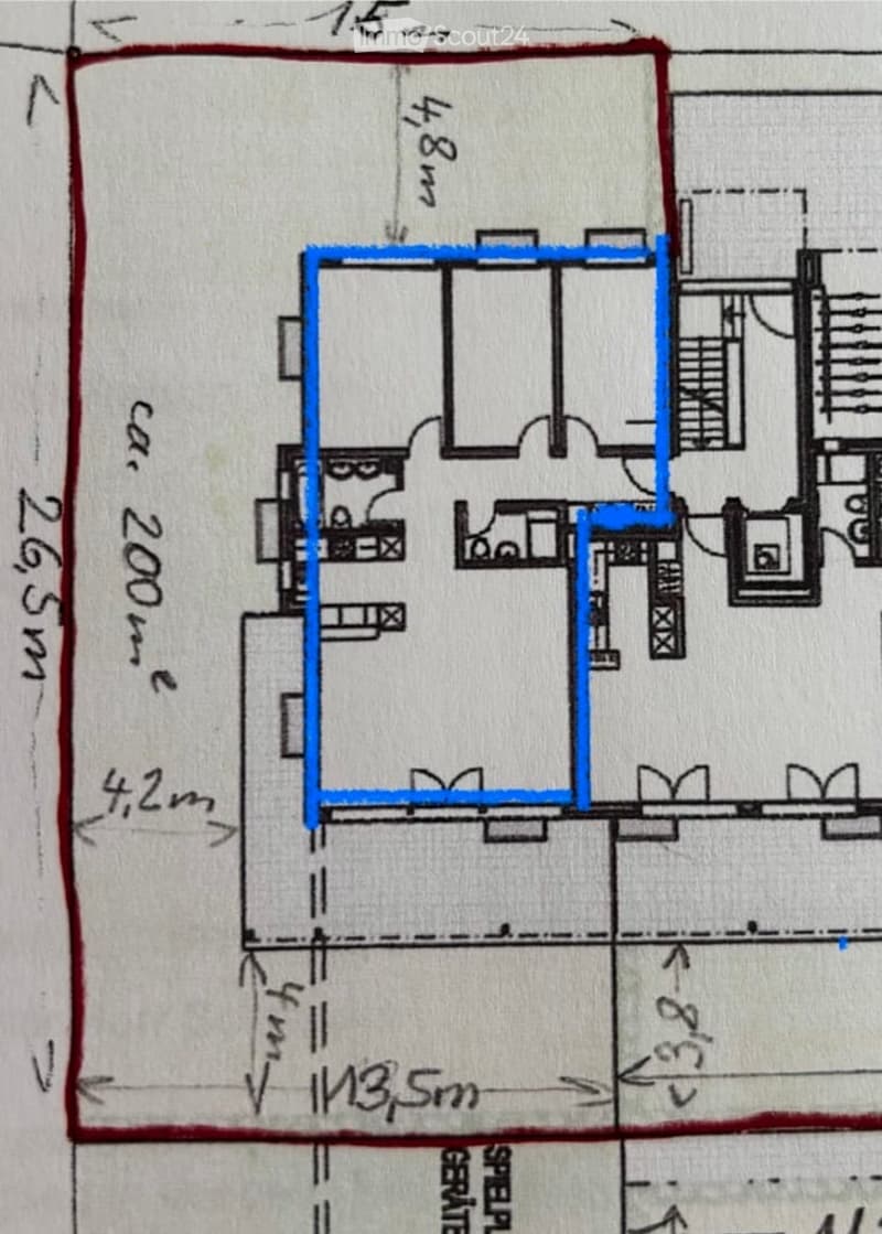Floor plan of a residential building showing multiple rooms, including a living area, bedrooms, and bathrooms.