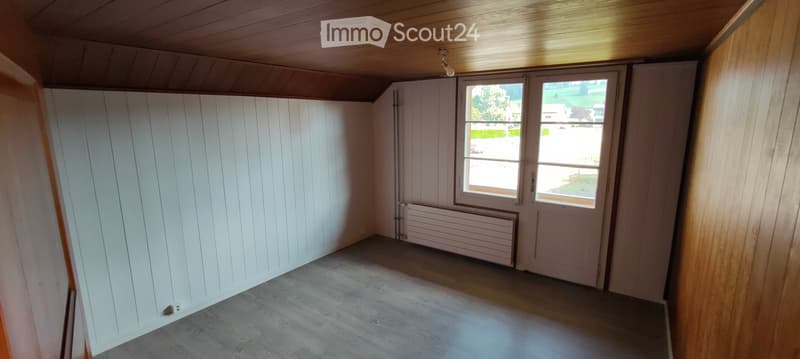 empty room, wooden ceiling, white walls, wooden floor, windows, radiator