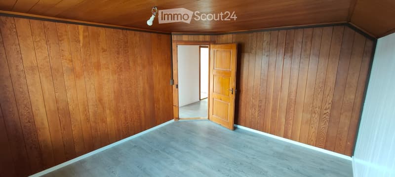 empty room, wooden walls, wooden floor, open door