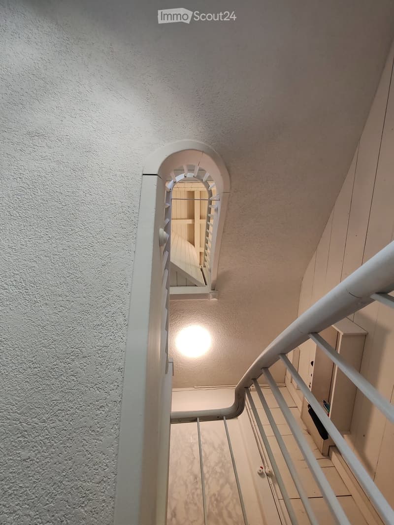 white staircase, white railing, white ceiling, white walls, white tiles, light