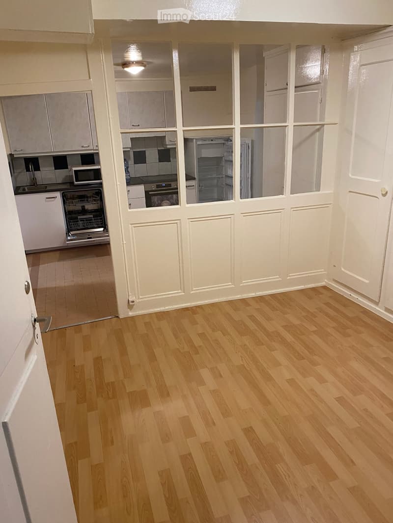 empty room, wooden floor, open kitchen, dishwasher, microwave, refrigerator