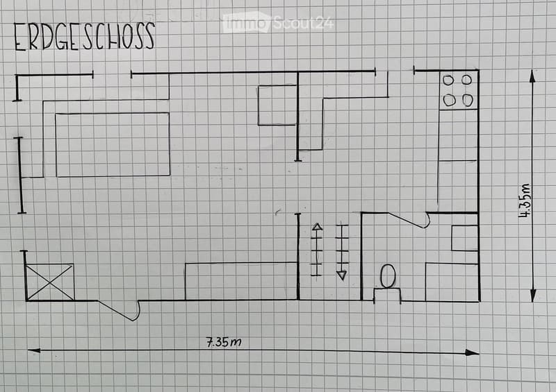 Floor plan of the ground floor showing a living room, kitchen, two bedrooms, and a bathroom.