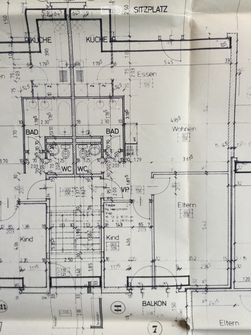 Floor plan showing a kitchen, two bathrooms, two bedrooms, a living/dining area, and a balcony.