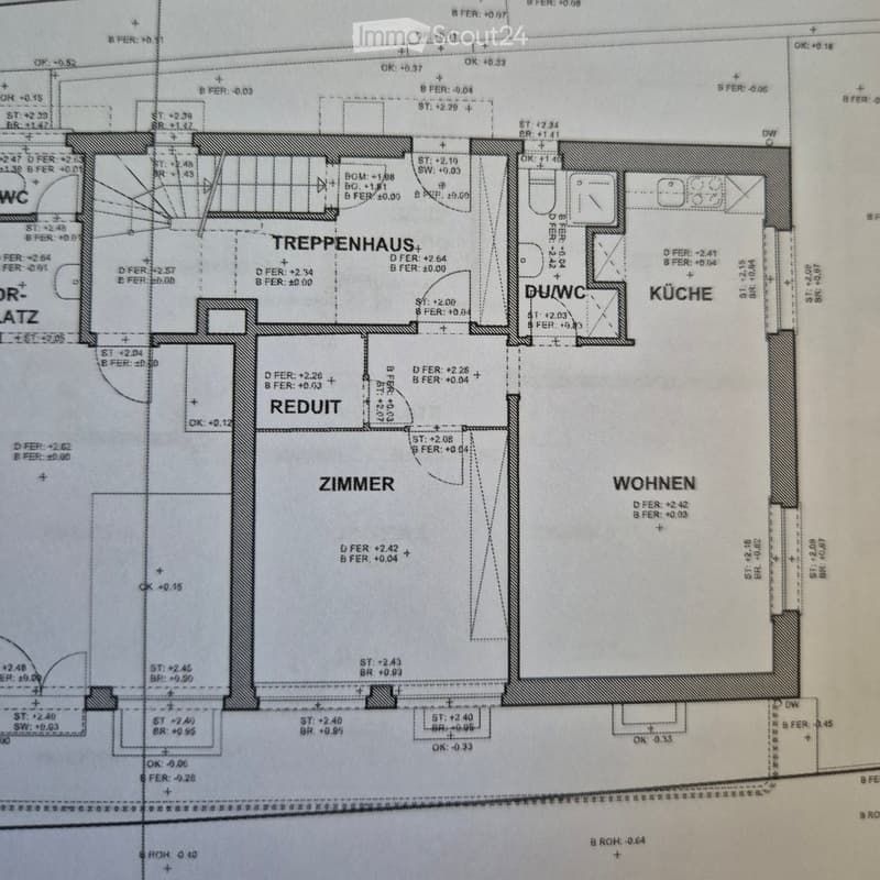 Floor plan showing a staircase, kitchen, living room, bedroom, and bathroom with labeled measurements and levels.