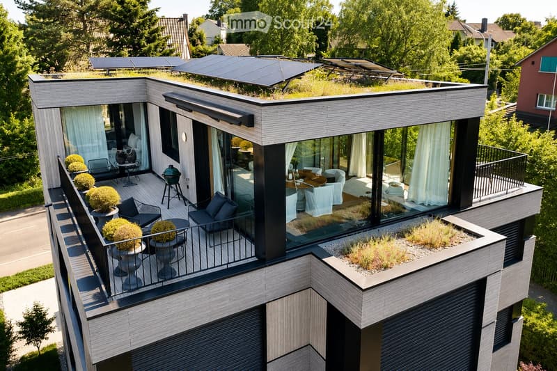 Modern rooftop terrace with a green roof, glass-enclosed living space, outdoor seating, and potted plants.