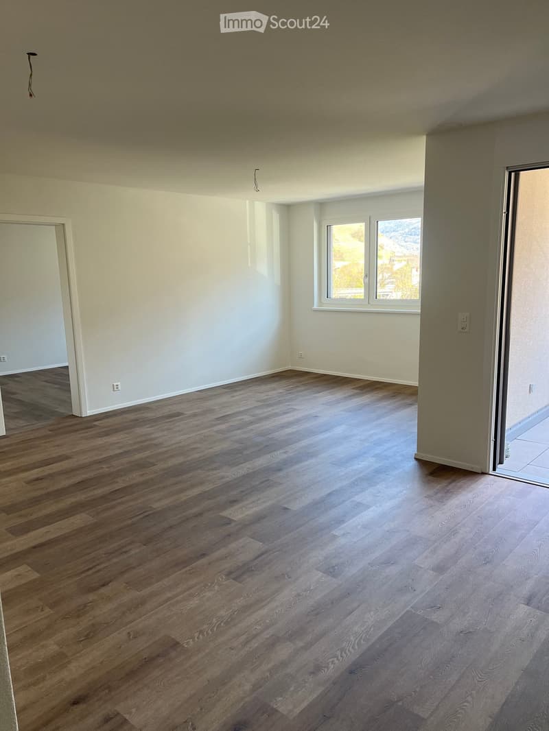 empty room, wooden floor, white walls, windows, sliding door