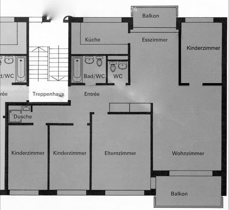 Floor plan showing a multi-room layout including a kitchen, dining room, living room, bedrooms, bathrooms, and balconies.