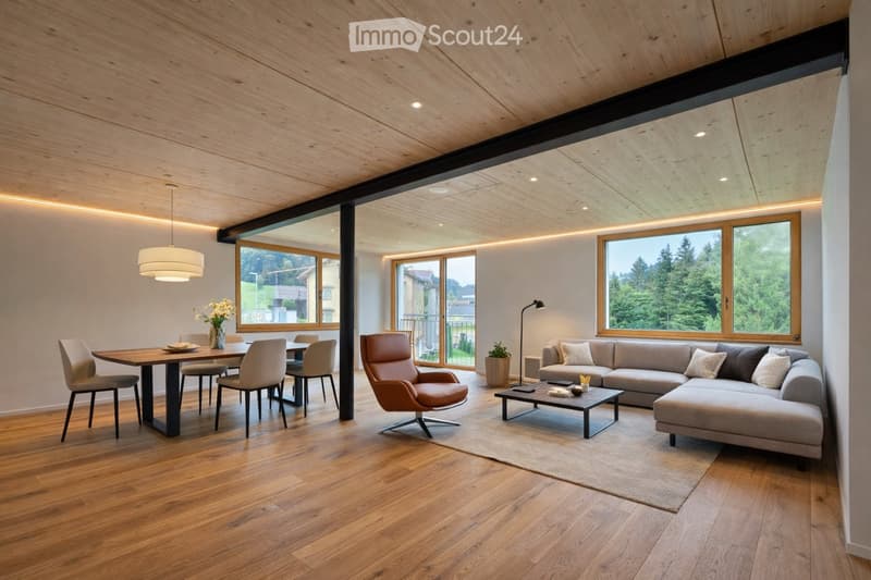 Modern living and dining area with wooden flooring, large windows, a sectional sofa, coffee table, dining table with chairs, and a leather armchair.