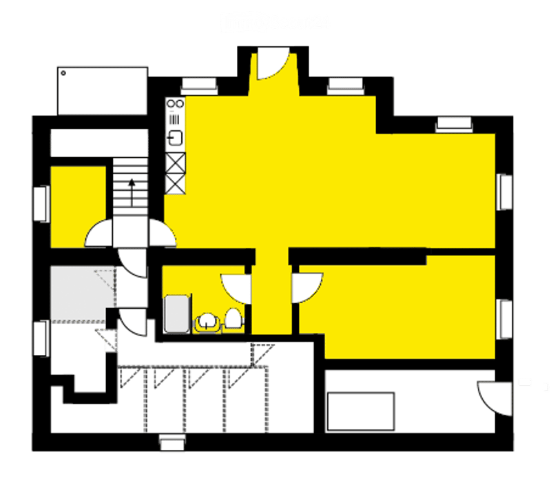Floor plan of a multi-room residential space with a large central living area, multiple bedrooms, bathrooms, and a kitchen.