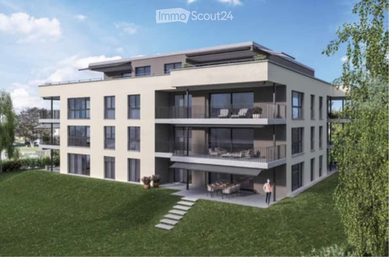 Modern multi-story residential building with balconies, large windows, and a landscaped lawn area.