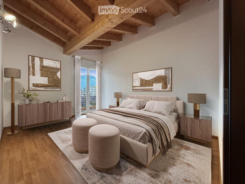 Modern bedroom with a large bed, nightstands, floor lamp, two round stools, and artwork on the walls. The room features wooden beams on the ceiling and large windows with a scenic view.