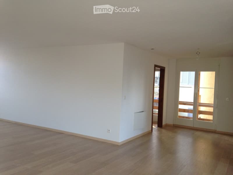 empty room, white walls, wooden floor, sliding doors, balcony