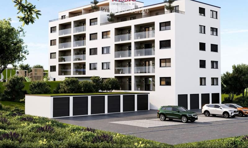 Modern multi-story residential building with balconies, garage, and parking area.