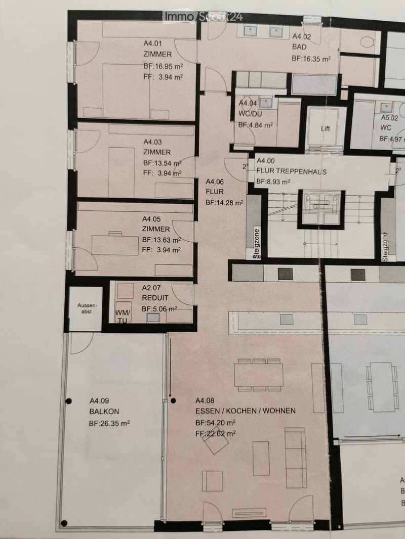 Floor plan showing a multi-room layout including a kitchen/dining/living area, several bedrooms, a bathroom, a WC/DU, a staircase hall, and a balcony.
