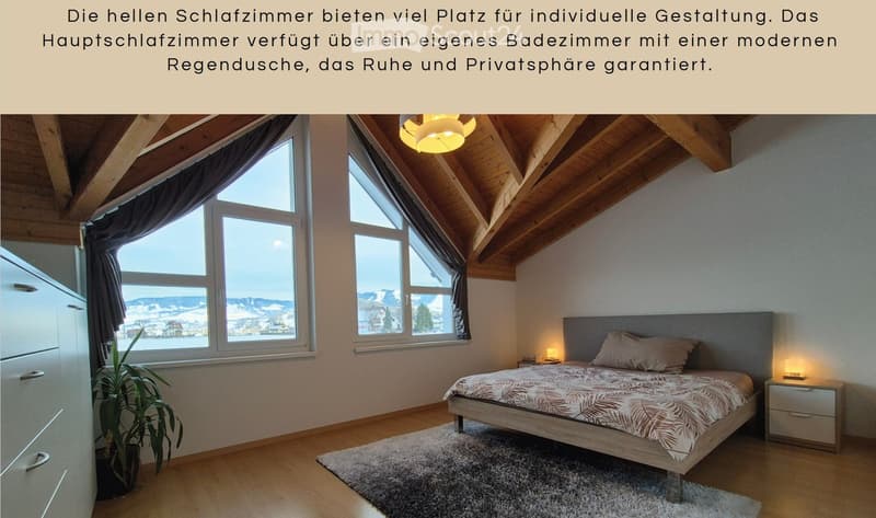 Bright bedroom with wooden slanted ceiling, large windows with dark curtains, bed with patterned bedspread, nightstand with lamp, plant, and wardrobe.