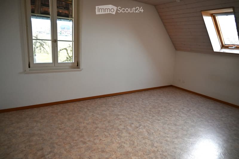 empty room, white walls, wooden ceiling, two windows, tiled floor