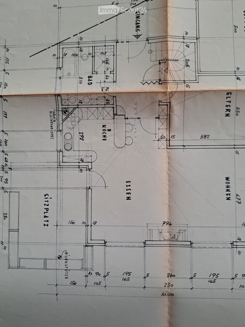 Floor plan showing a layout with labeled rooms including kitchen, dining area, living room, and bathrooms.