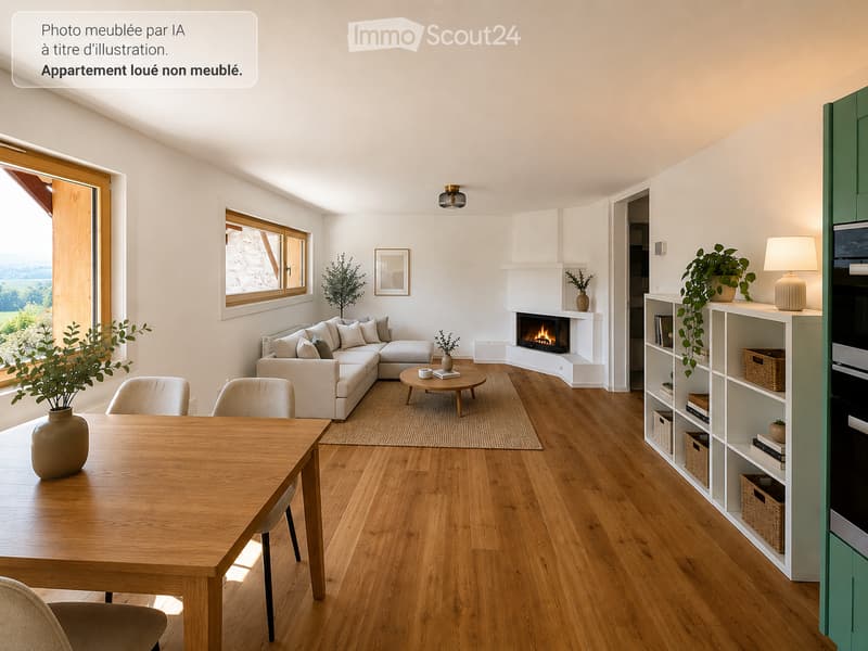 Bright, open living and dining area with wooden flooring, large windows, a fireplace, a sectional sofa, dining table, and bookshelf.