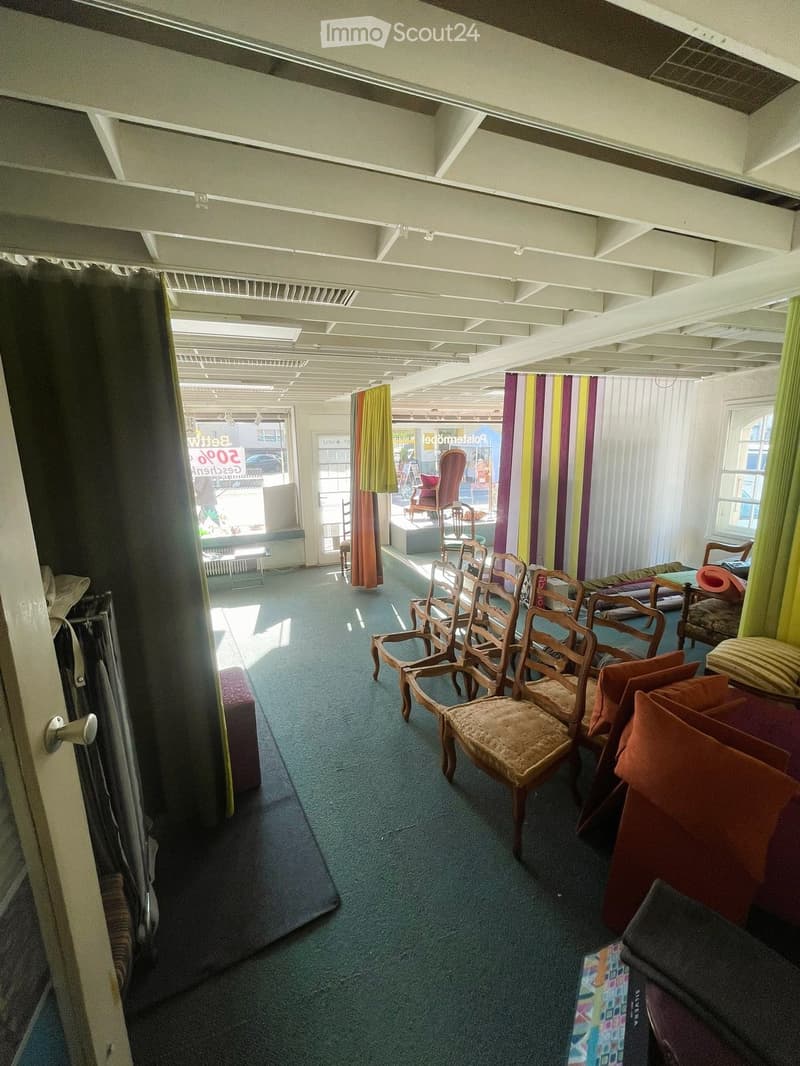 empty room with chairs, carpet, curtains, and a radiator