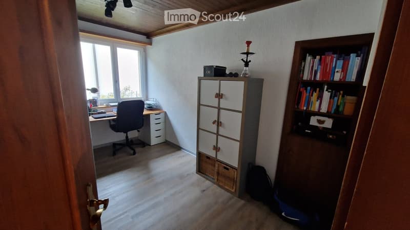 desk, chair, cabinet, bookshelf, books, storage boxes, lamp, backpack