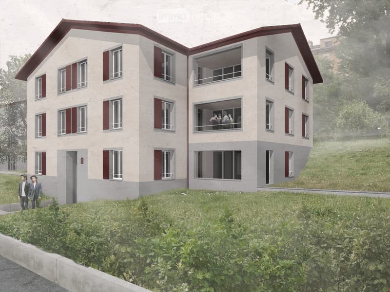 Two-story residential building with beige walls, red shutters, and a red roof. Features multiple windows and a balcony on the upper floor.