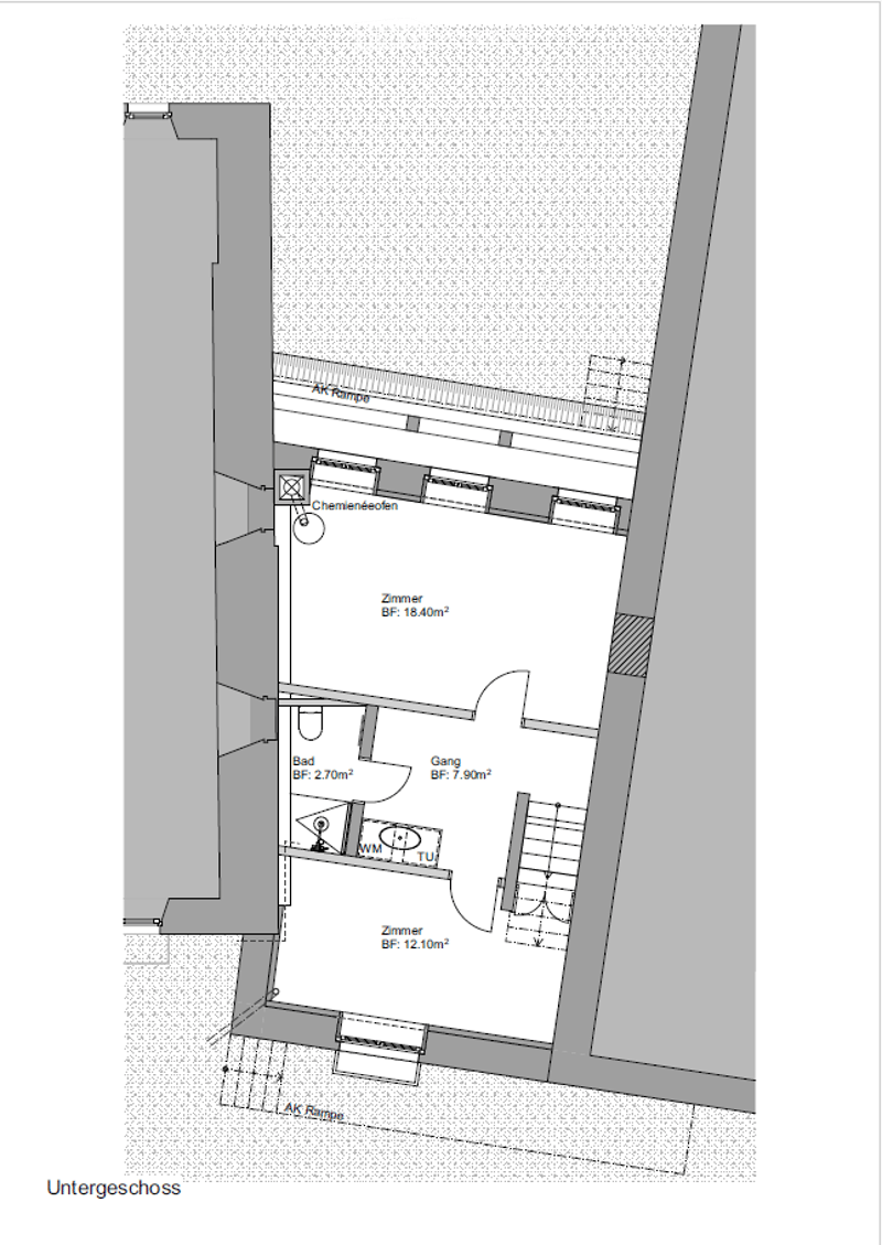 Floor plan of a basement level showing a bathroom, hallway, two bedrooms, and a storage area.
