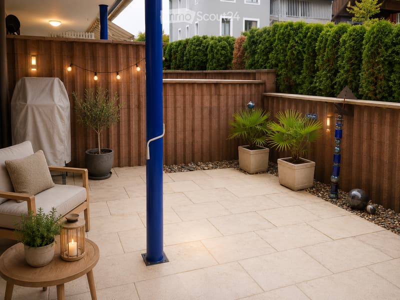 Modern balcony with wooden decking, potted plants, a small sofa, a wooden side table, and string lights.
