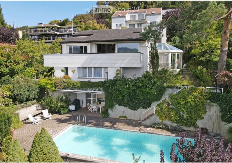 House. A multi-story house with a modern design, surrounded by lush greenery. Features include a swimming pool, outdoor seating area, and a covered patio with a glass roof.