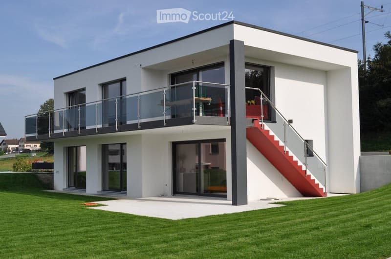 modern white house, glass balcony, red staircase, large windows, green lawn