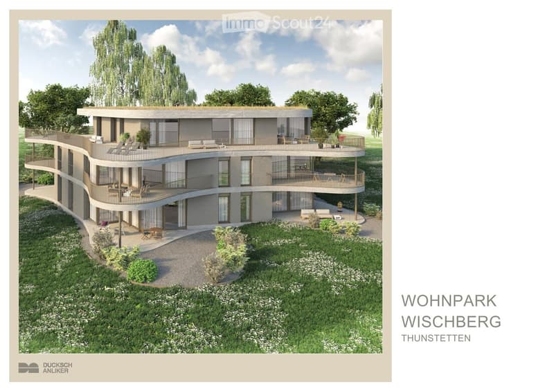 Modern two-story house with curved design, multiple balconies, outdoor seating, surrounded by greenery and a well-maintained lawn.