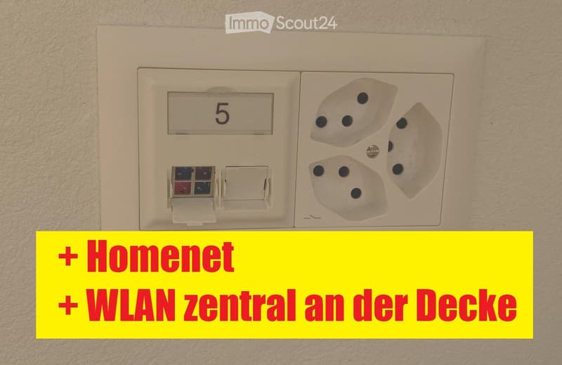 A white electrical outlet and switch panel mounted on a wall, featuring multiple sockets and a numbered switch labeled '5'.