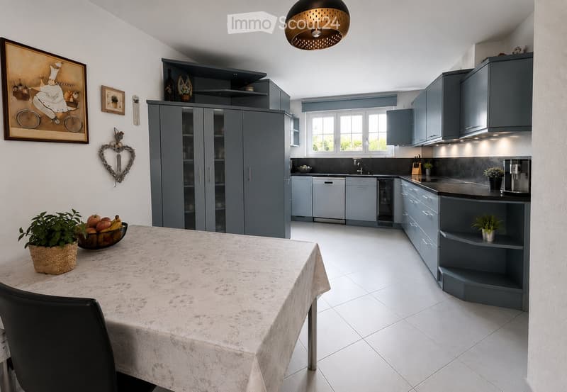 Modern kitchen with grey cabinets, white tiled floor, central island, dining table with chairs, and various appliances including a dishwasher and sink.