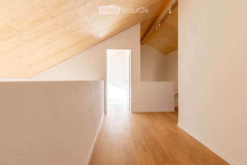 wooden ceiling, white walls, wooden flooring, white wall with a door, white wall with power outlets, open door with white walls and wooden floor