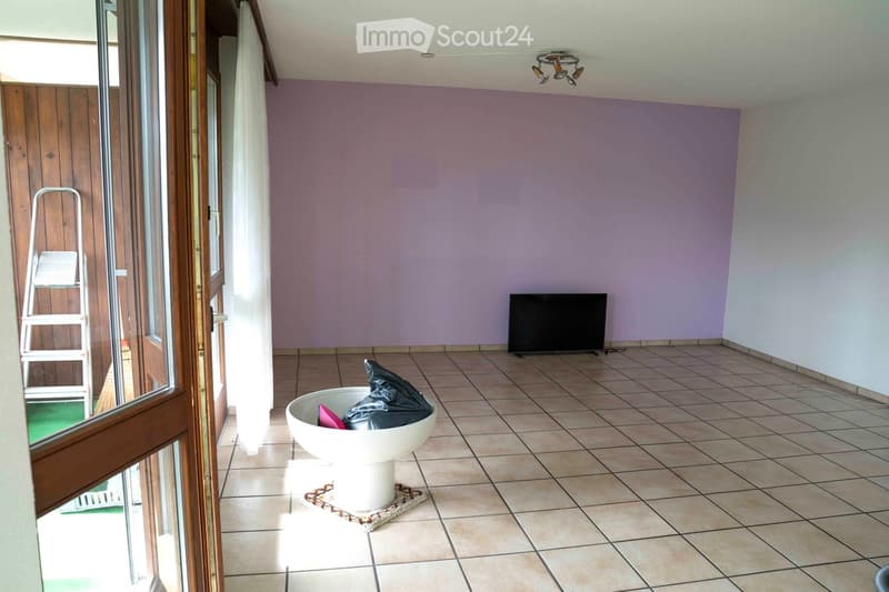 empty room, tiled floor, sliding glass door, purple wall, flatscreen TV, ladder
