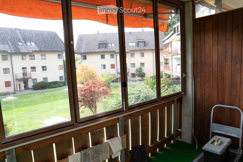 large balcony, large windows, view of the yard, wooden walls