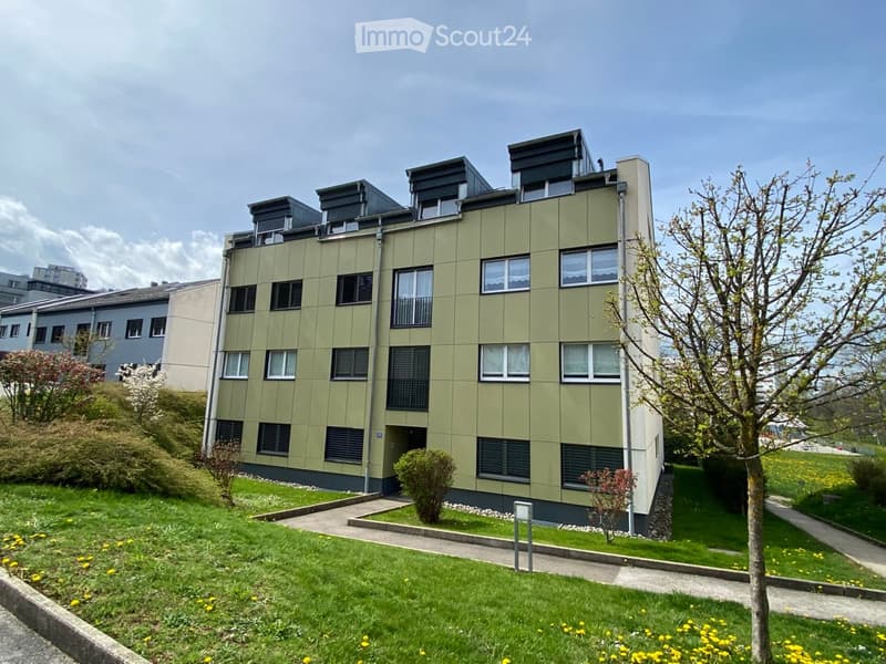 apartment building, multiple windows, entryway, exterior wall with greenery