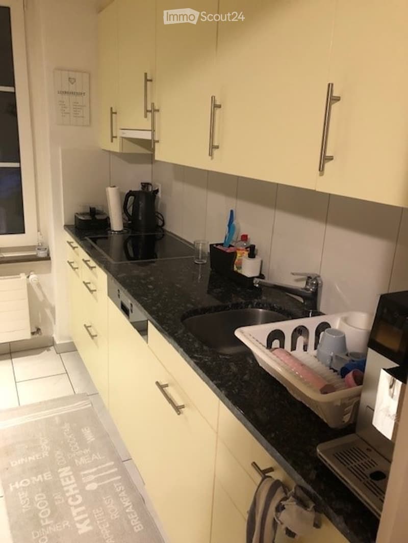 {"type": "Kitchen", "objects": ["sink", "faucet", "dish rack", "cup", "cupboard", "drawer", "electric kettle", "bottle", "bottle", "bottle", "bottle", "bottle", "bottle", "bottle", "bottle", "bottle", "bottle", "bottle", "bottle", "bottle", "bottle", "bot