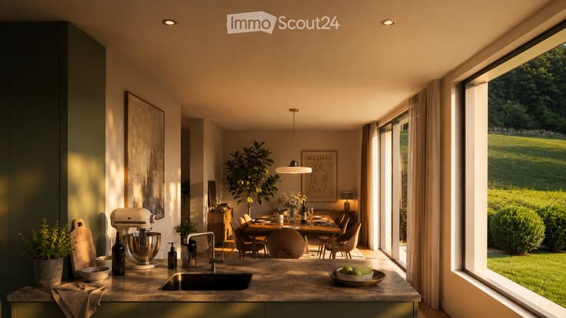 Modern kitchen with a large island, sink, mixer, and dining area with a table and chairs. Large windows offer a view of a green landscape.