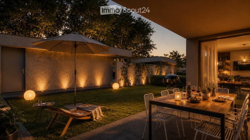 Well-lit outdoor dining area with a wooden table, chairs, umbrella, and a grill in the background. The space features a modern house with warm lighting and a grassy lawn.