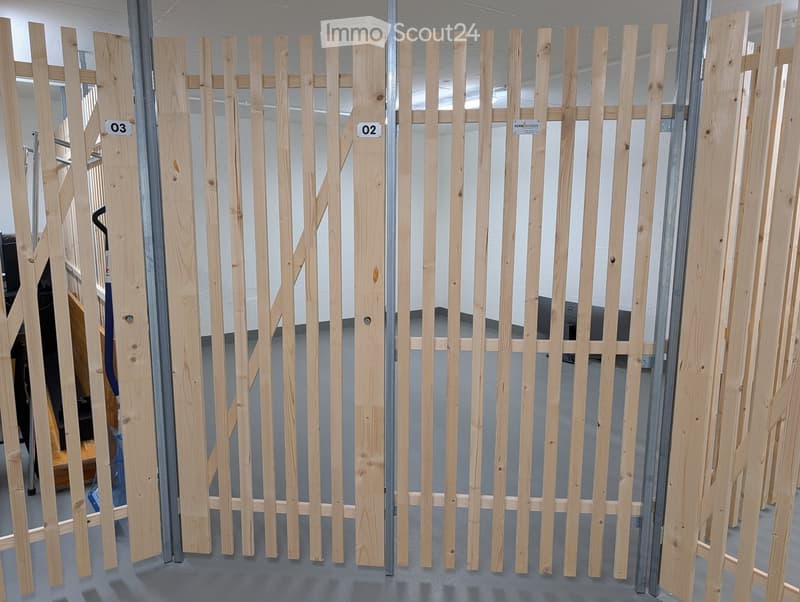Wooden fence panels with vertical slats and horizontal rails, displayed in a showroom setting with numbered labels.