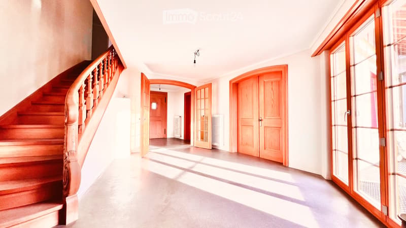 wooden staircase, white walls, wooden floors, arched doorways, sliding glass doors, glass windows, ceiling light