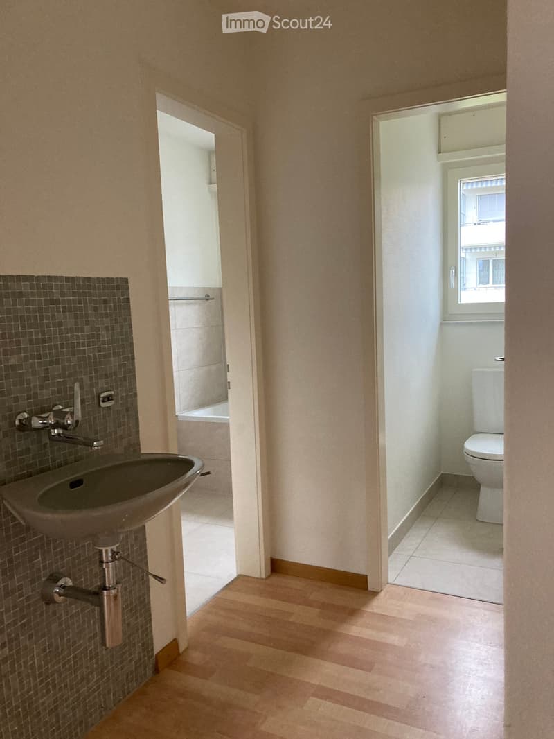 a bathroom with a sink, bathtub, and toilet
