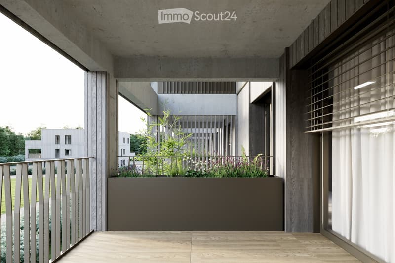 Modern balcony with wooden flooring, metal railing, and a planter box with greenery and flowers.