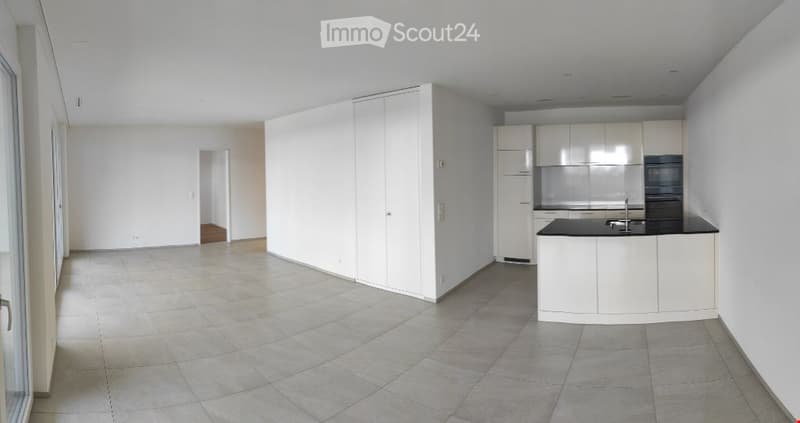 Empty, unfurnished room with white walls, tiled floor, and built-in white cabinetry. No furniture or personal items present.