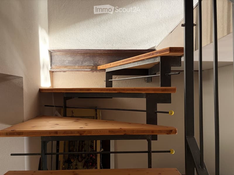 metal handrails, wooden steps, open interior space
