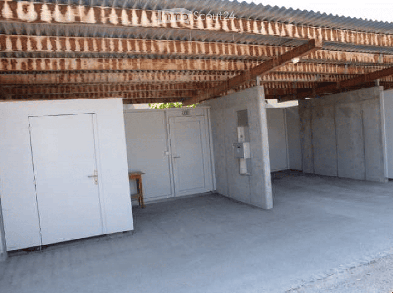 {"visible_features": [], "type": "Garage", "objects": [], "description": "Empty garage with concrete floor, white walls, and a wooden table near the back wall.", "localized_descriptions": {"EN": "Empty garage with concrete floor, white walls, and a wooden
