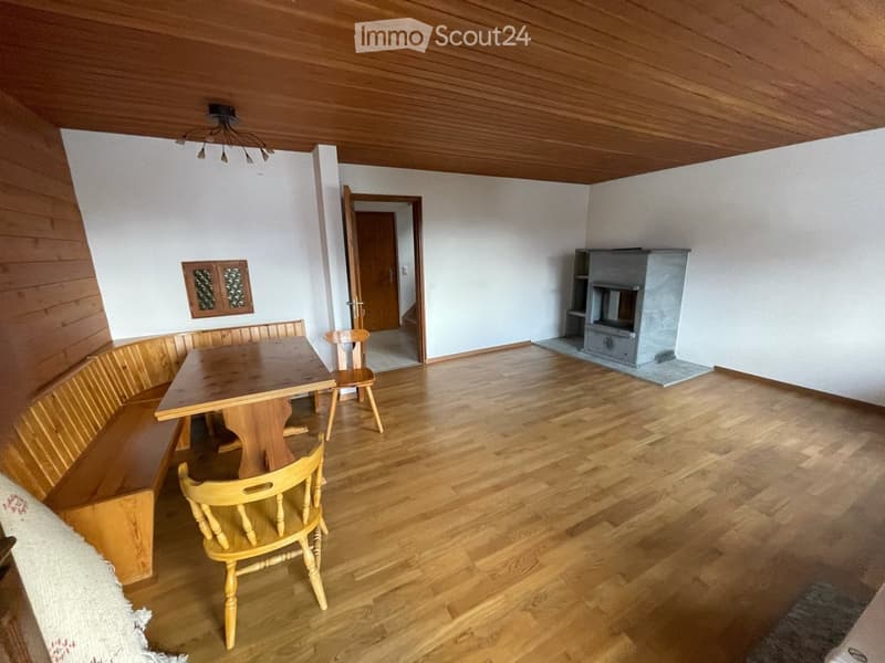 wooden floor, wooden table, wooden chairs, wooden bench, fireplace, chandelier