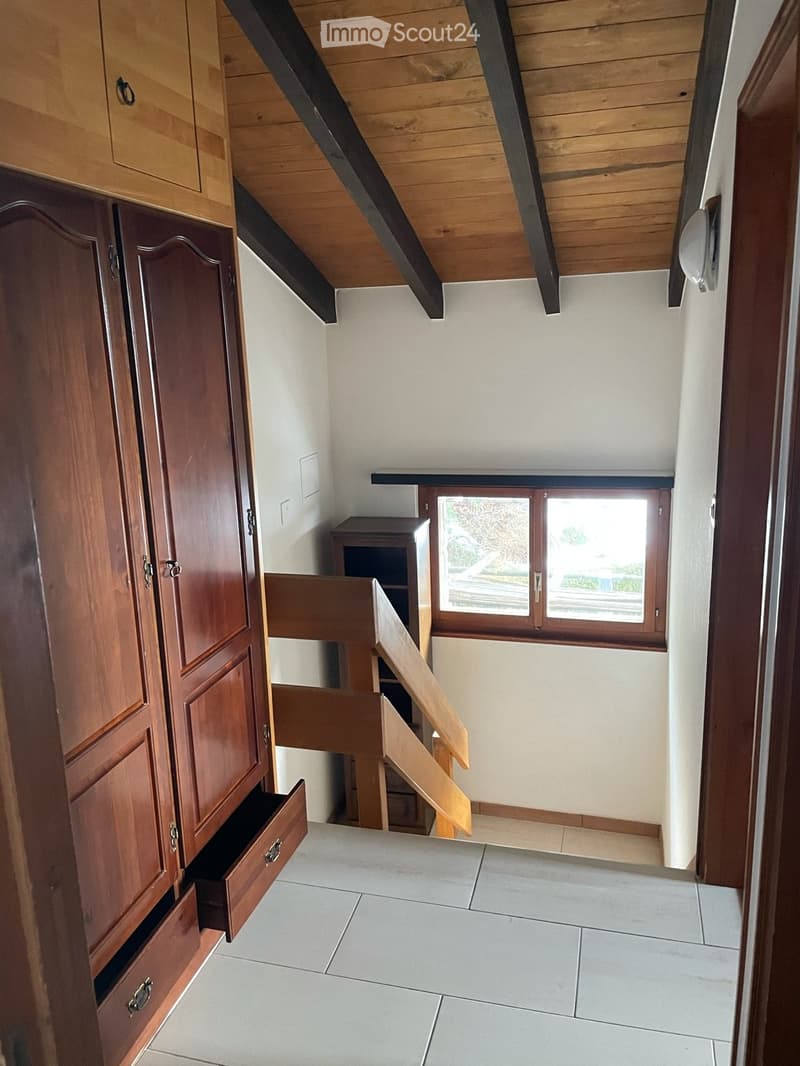 wooden wardrobe, wooden staircase, white tiles, wooden ceiling, window